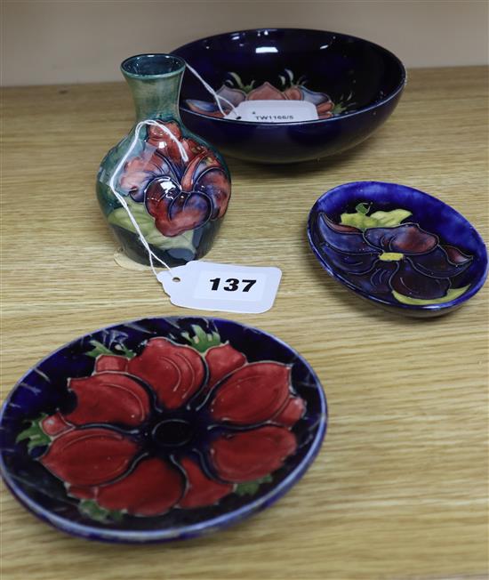 A Moorcroft Anemone small bowl, a similar pin dish, a small Hibiscus vase and a Clematis pin dish (4)